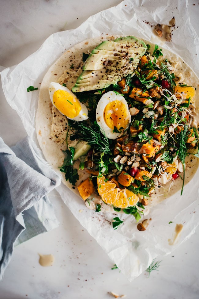 Filling lunch wrap with roasted sweet potato, egg, parsley and hummus | TheAwesomeGreen.com