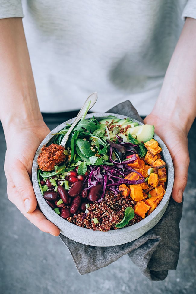 My favorite Buddha bowl, with red quinoa, sauerkraut and sun-dried tomato dressing #vegan #buddhabowl #winterbowl #salad #detox #healthy | TheAwesomeGreen.com