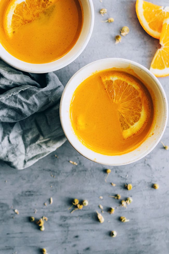 Ginger and turmeric tea with orange juice, packed with healing properties #detox #healing #ayurveda #turmeric | TheAwesomeGreen.com