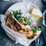 Falafel sandwich with pita bread and tahini sauce #vegetarian #lunch #sandwich #falafel | TheAwesomeGreen.com