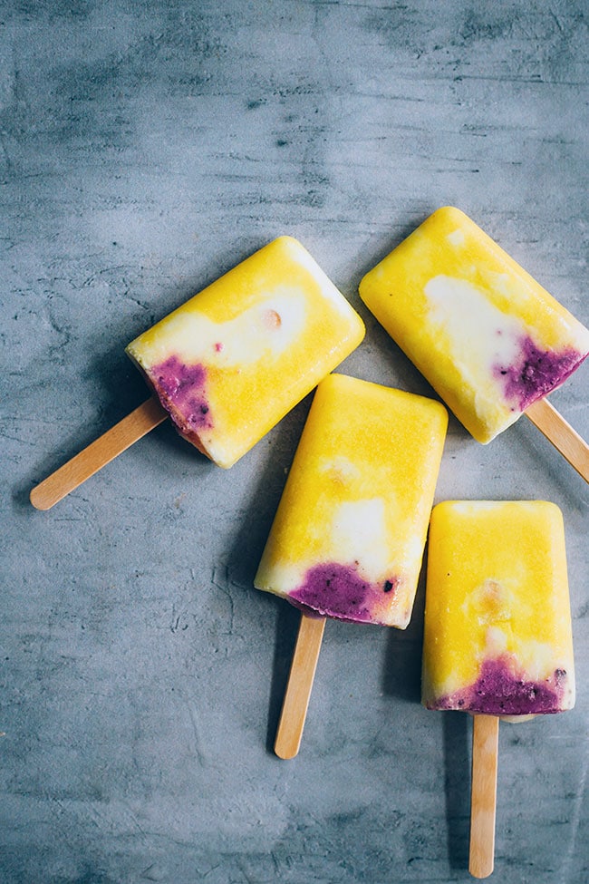 Mango ice cream pops, with coconut and blueberries #vegan #icecream #summer #mango | TheAwesomeGreen.com